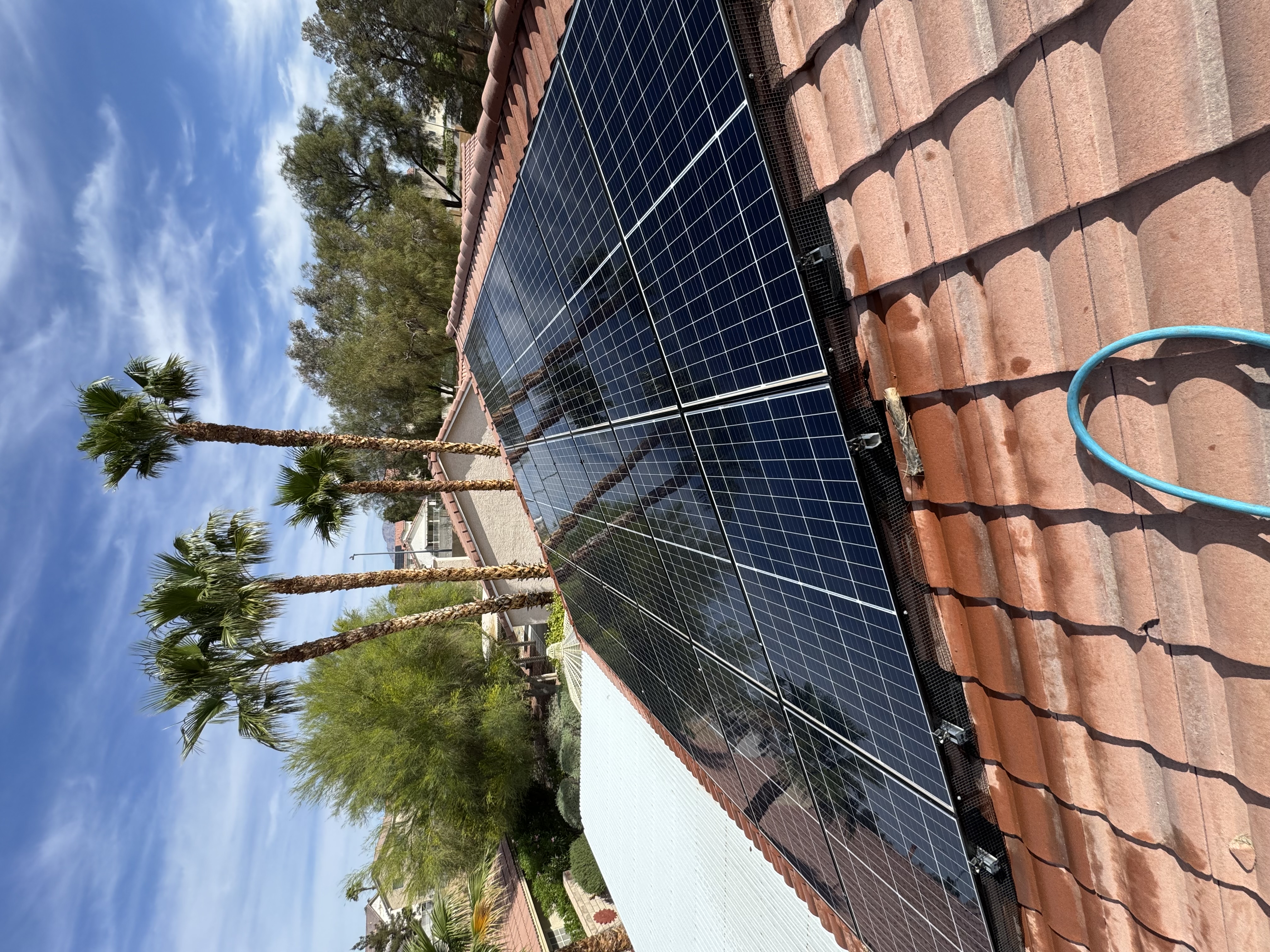 Luxury rooftop solar array in Southern Highlands Las Vegas being cleaned by Neon
