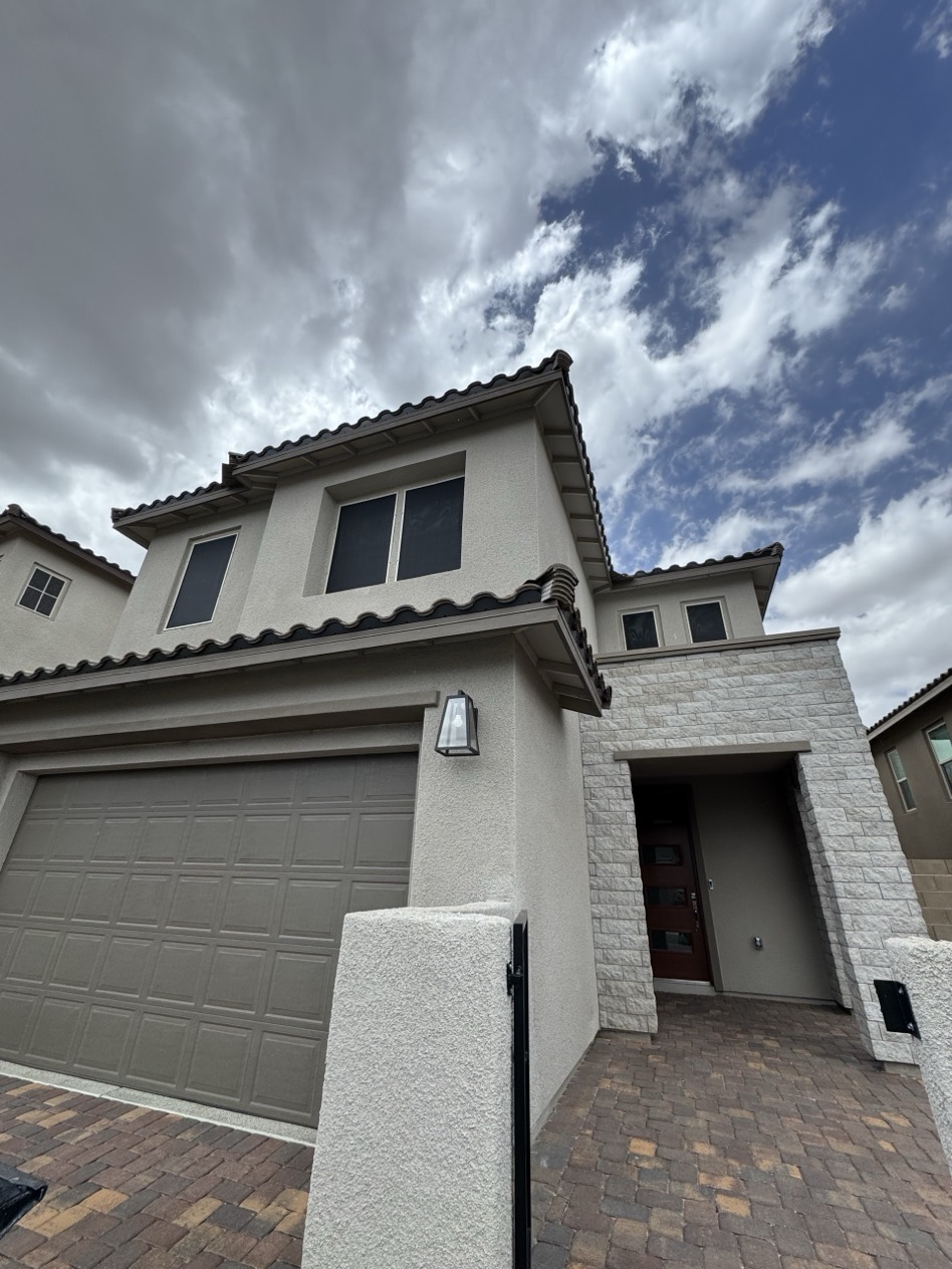 Two-story Summerlin Las Vegas home with custom solar screens installed across multiple windows